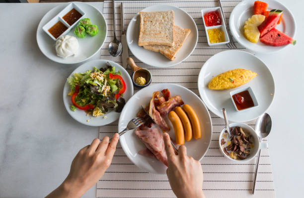 big breakfast and some fruits top view of a woman having big breakfast and some fruits cerial stock pictures, royalty-free photos & images