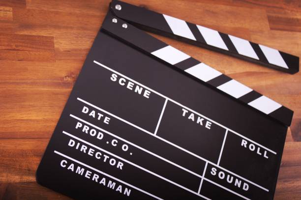 istock ,Movie clapper on wood 849320958
