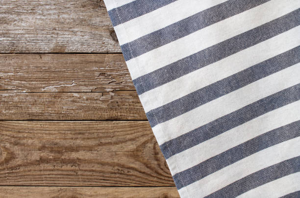 Striped napkin on the wooden background stock photo