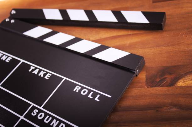 istock ,Movie clapper on wood 849324286