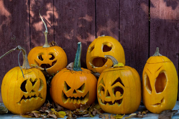 istock Halloween pumpkins on wooden rustic background with copy space 849324564