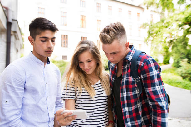 istock Group of students in front of university taking selfie. 849331348