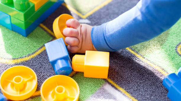 istock Cute one year old baby playing 849331394
