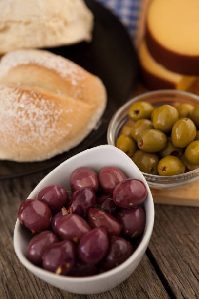 istock High angle view of olives in bowls by bread 849334754