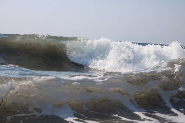 Waves and water puddle Sea Waves hava stock pictures, royalty-free photos & images