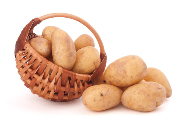 istock Potato tuber  in wicker basket isolated on white background 849335342