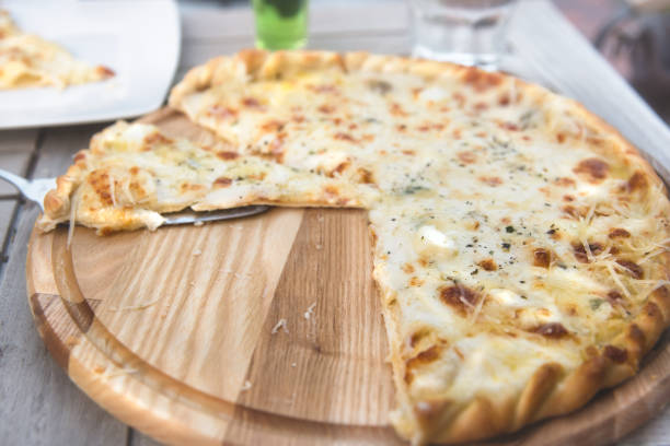 Close-up of pizza slice on spatula.