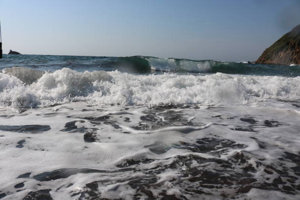 Waves and water puddle Sea Waves hava stock pictures, royalty-free photos & images