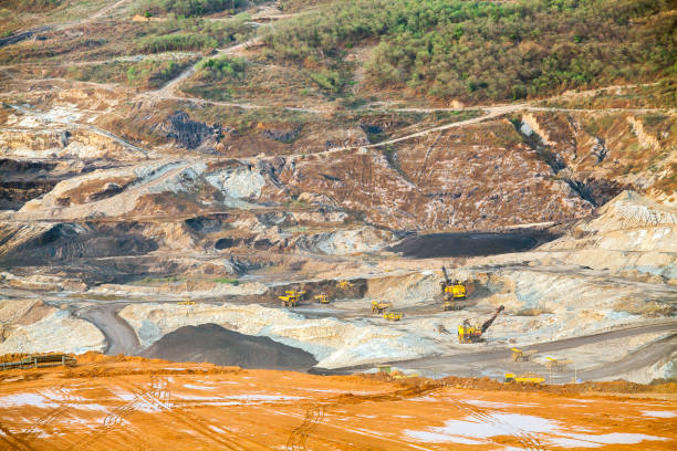istock Part of a pit with big mining truck working 849355274