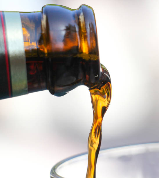 istock pouring dark beer in a glass 849361502