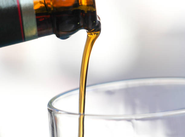 istock pouring dark beer in a glass 849361504
