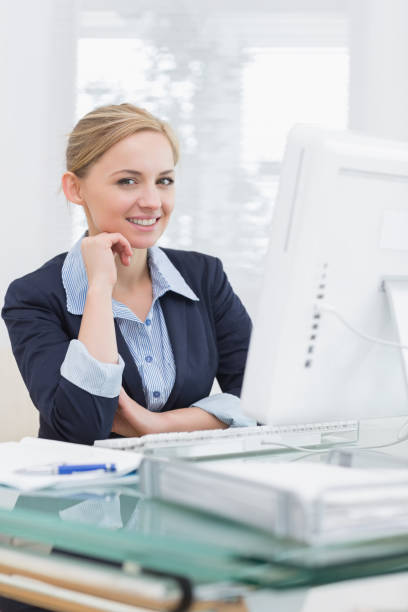 istock Smiling confident business woman at office desk 849361740