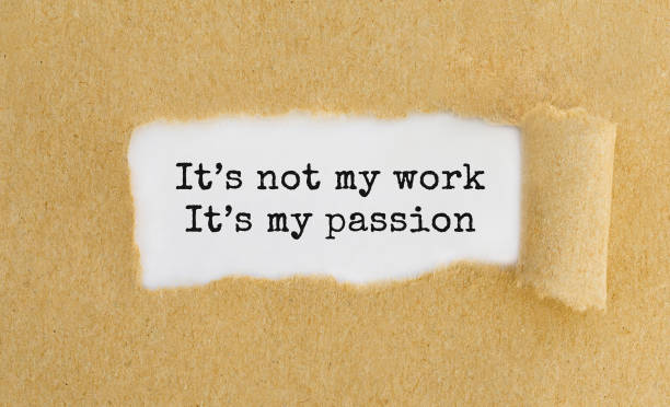 Text It's not my work It's my passion appearing behind ripped brown paper. stock photo