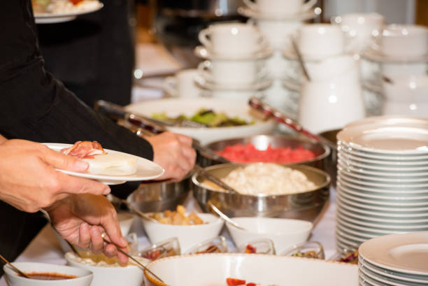 istock People are picking food from a buffet in a restaurant during a festive event 849368692