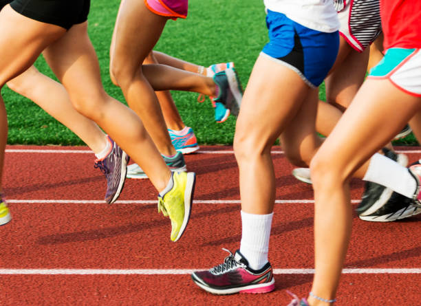 istock Runners legs on a red track 849380490