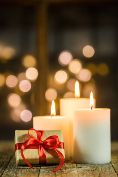 istock Burning candles with Christmas gift 849384524
