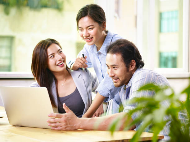 istock happy asian business team working together in office 849390960