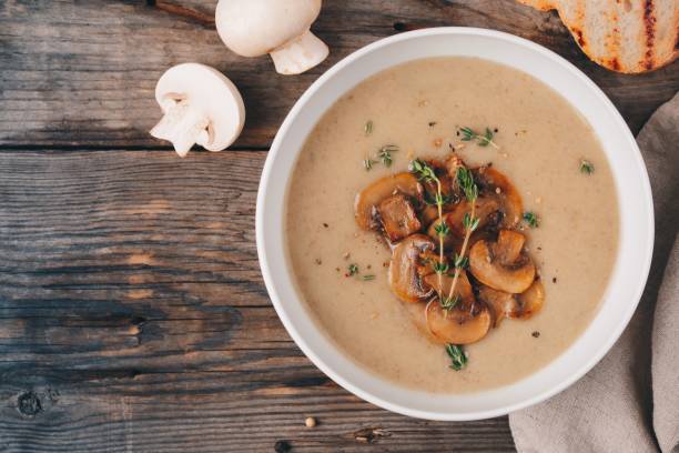 istock Cream soup puree with mushroom on wooden background 849391824