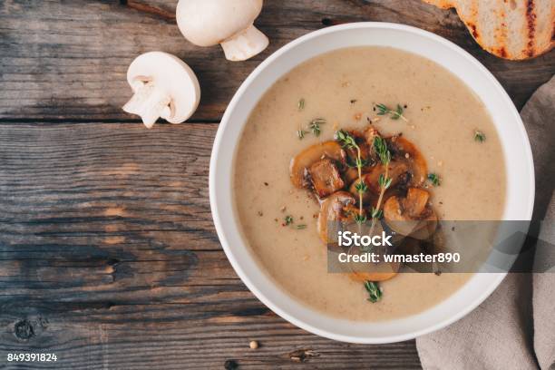 Cream Soup Puree With Mushroom On Wooden Background Stock Photo - Download Image Now