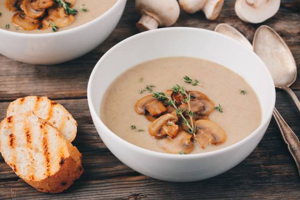 istock Cream soup puree with mushroom on wooden background 849391990
