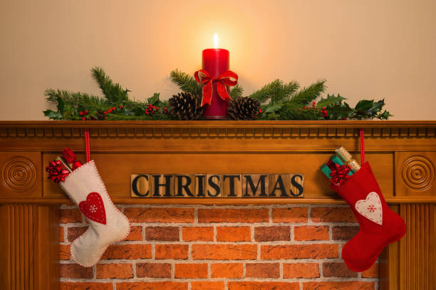 istock Christmas fireplace with stockings and candle 849394934