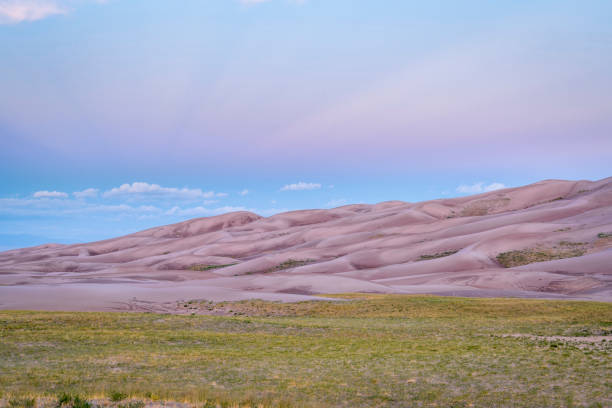 Great Sand Dunes National Park at dawn wet sand dunes patterns and texture at dawn - Great Sand Dunes National Park and Preserve in Colorado great sand dunes national park stock pictures, royalty-free photos & images