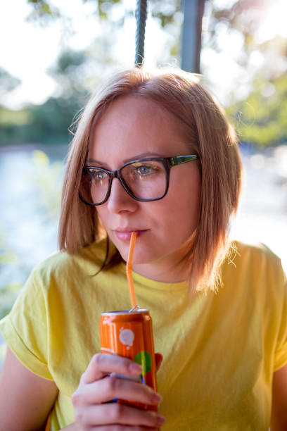 istock Attractive young woman sitting on a river 849396216