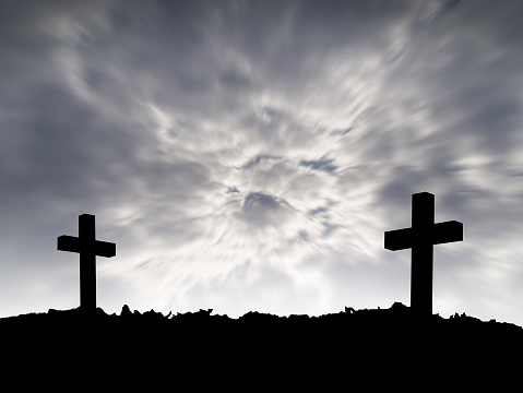 grave, silhouette of two cross on hill top with motion dark storm clouds on dramatic sky background