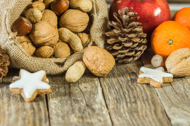 istock Christmas food, nuts, cookies, apple and oranges 849402450
