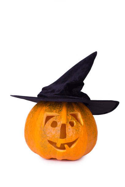 istock Halloween pumpkin, funny face in hat, isolated on white background 849409746
