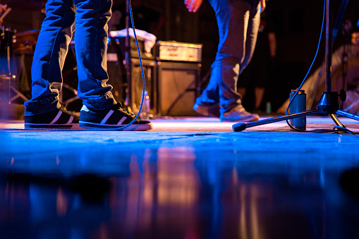 Band members at stage during the rock concert