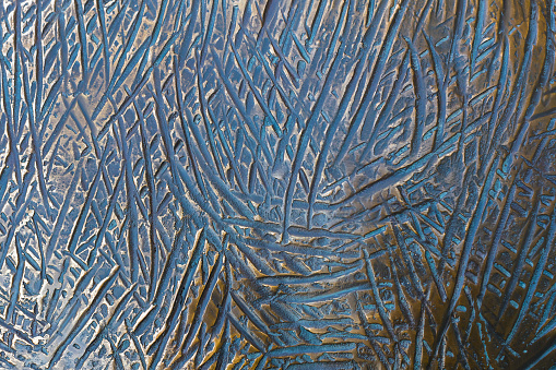 Background of colored copper metal with large scratches