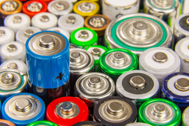 istock Composition with used alkaline batteries. Recyclable waste series. 849425288