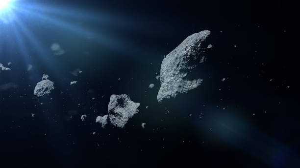 a swarm of asteroids lit by the Sun a group of huge asteroids flying through space asteroid stock pictures, royalty-free photos & images