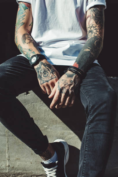 istock Crop tattooed man outside 849428738