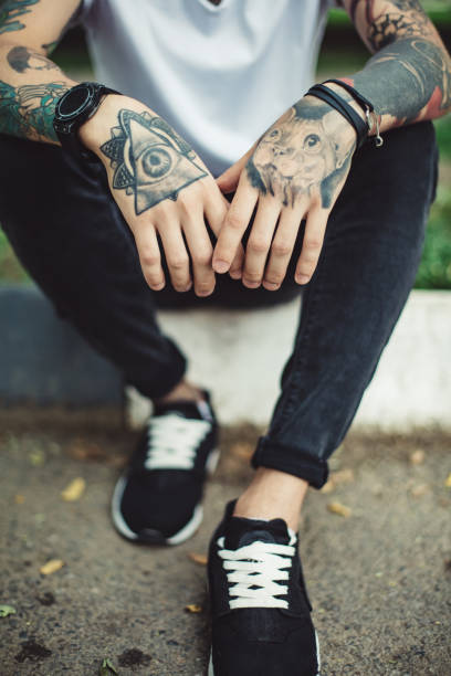 istock Crop tattooed man outside 849432312