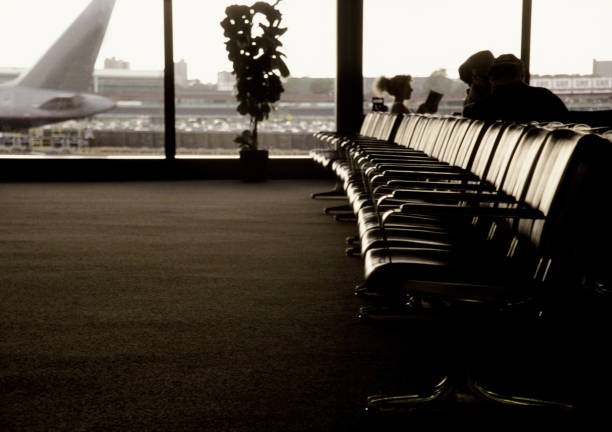 istock Airport departure lounge interior with waiting passengers.. 849432842
