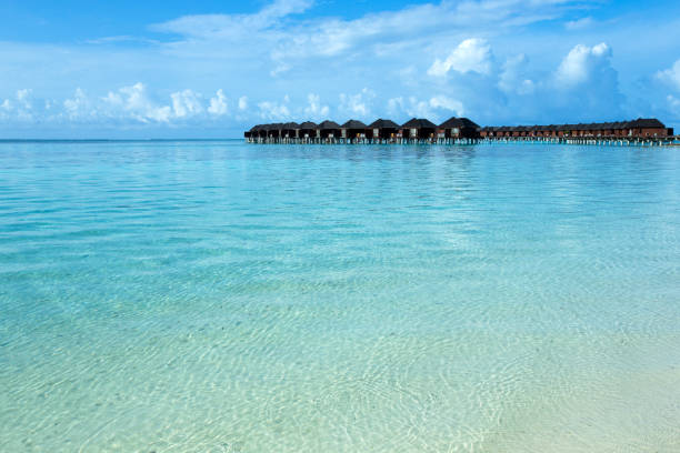 Over water bungalows with steps into amazing green lagoon