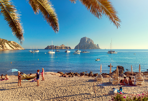 Ibiza Island, Spain - June 12, 2017: Cala d'Hort beach. Cala d'Hort in summer is extremely popular, beach have a fantastic view of the mysterious island of Es Vedra. Ibiza Island, Balearic Islands. Spain