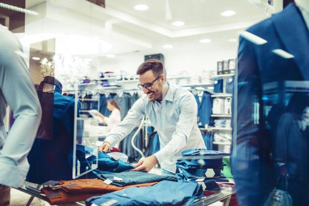 istock Handsome young man buying clothes in the store 849446628