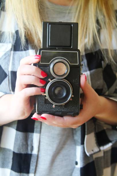 istock female holding vintage camera 849449906