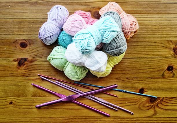 Organizing colorful yarn balls in wicker basket cells