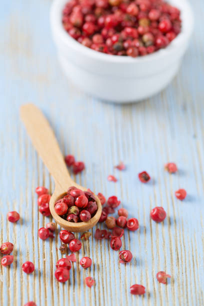 istock red peppercorns on wooden table 849455082