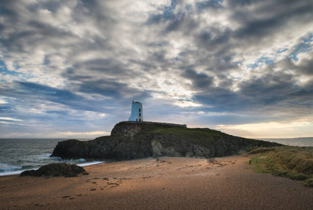 istock Stunning Twr Mawr lighthouse landscape from beach with dramatic sky and cloud formations 849455564
