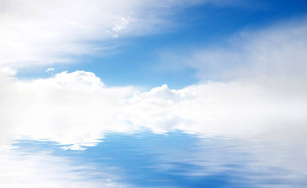 istock white fluffy clouds with rainbow in the blue sky 849460698