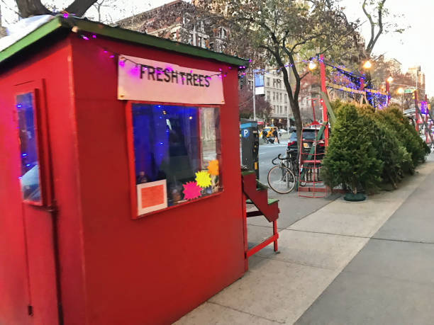 Christmas Trees For Sale On A Street Corner in NYC Christmas trees for for sale on an Upper West Side street corner in New York City. city street street corner tree stock pictures, royalty-free photos & images