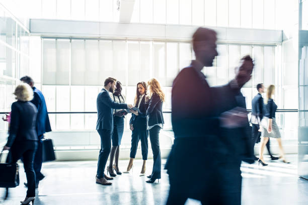 Rush hour Side view of businesspeople working in the office defocused office business motion stock pictures, royalty-free photos & images