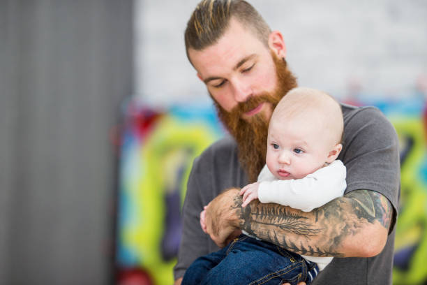 istock Tattooed Dad with Baby Boy 849475674