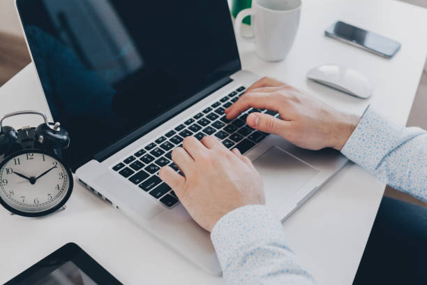 istock Businessman at work. Close-up top view of man working on laptop 849479260