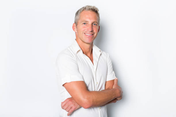 istock Portrait of confident mature man standing on white background 849479330